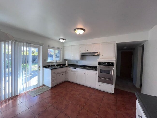Building Photo - Freshly painted home with large backyard. ...