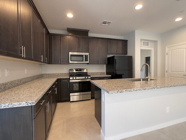 Building Photo - 4 BED 2 BATH 2 CAR GARAGE SINGLE STORY SINGLE FAMILY HOME w/ PAVED BACKYARD IN CADENCE COMMUNITY,...