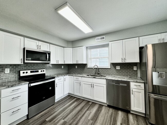 Building Photo - Updated & Ready For You NOW! A Pet-Friendly Home w/Attached Garage, All Appliances Convey - HUGE ...