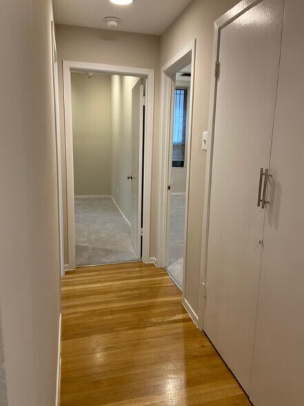 Hall to bedrooms with walk-in closet - 2038 18th St NW