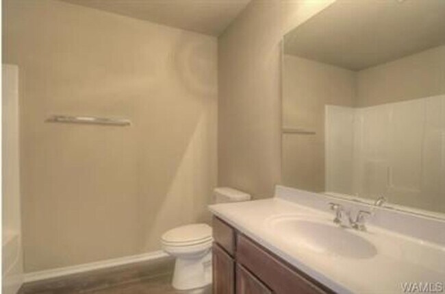 Building Photo - Stylish 4BR/2BA Home with Garage & Privacy...