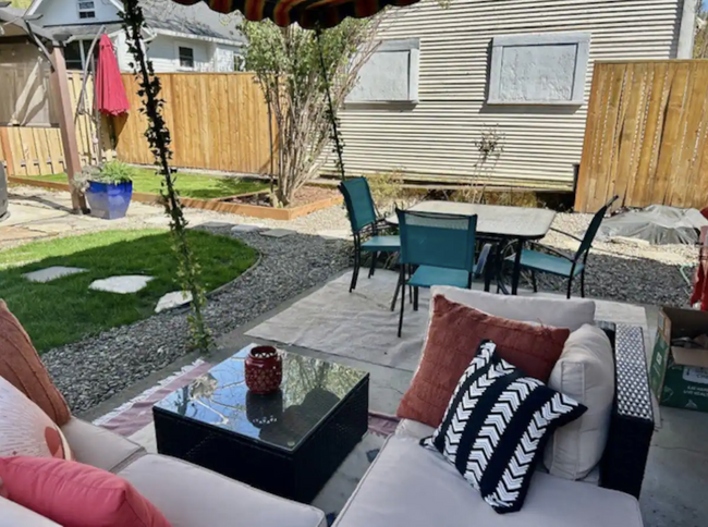 Outdoor seating area for lounging or dining in backyard. - 4115 SE Gladstone St