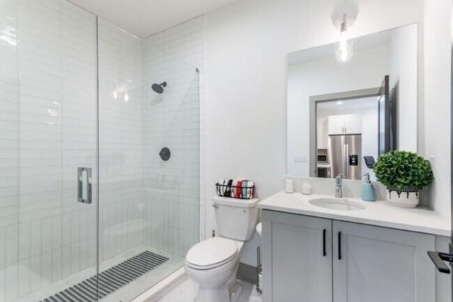 Building Photo - Modern Living Meets Walkable City Charm in...