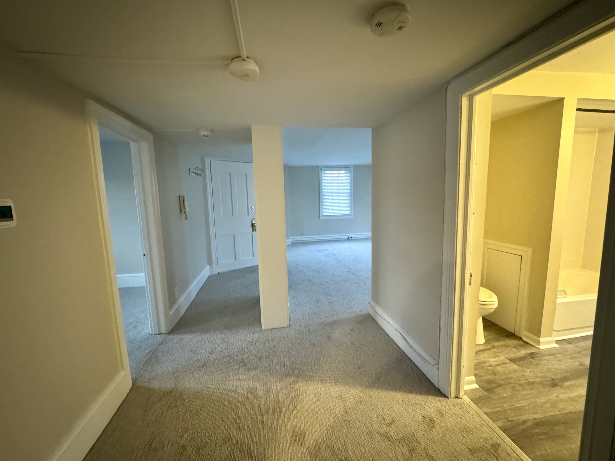 spacious hallway separates living room from kitchen and bedrooms and provides additional room for fu - 2 Mechanic St