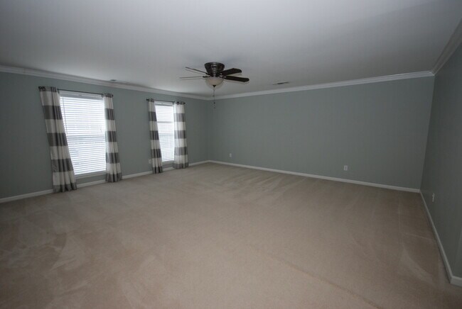 Building Photo - Oversized Executive Style Home with Finish...