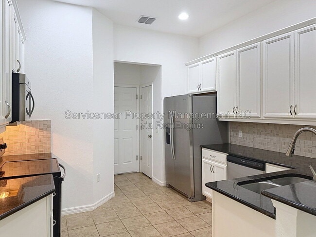 Building Photo - 9428 Woodcrane Dr