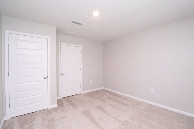 Building Photo - Coming Available Soon – 4BR/2BA Brick Home with Open Floor Plan, Solar Panels & 2-Car Garage in L...