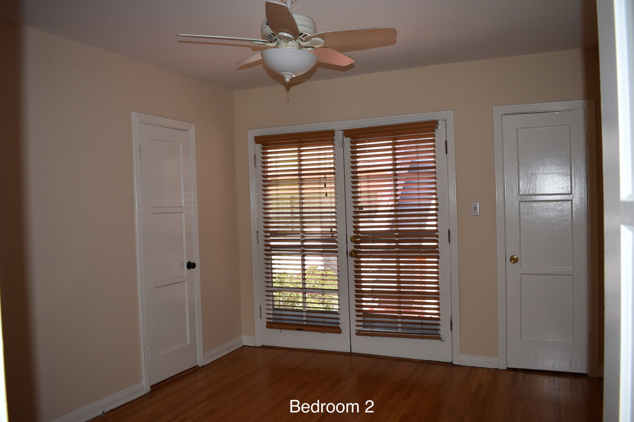 Bedroom #1 with French doors to back patio - 538 N Detroit St