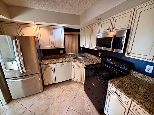 Building Photo - 8657 Boca Glades Blvd W