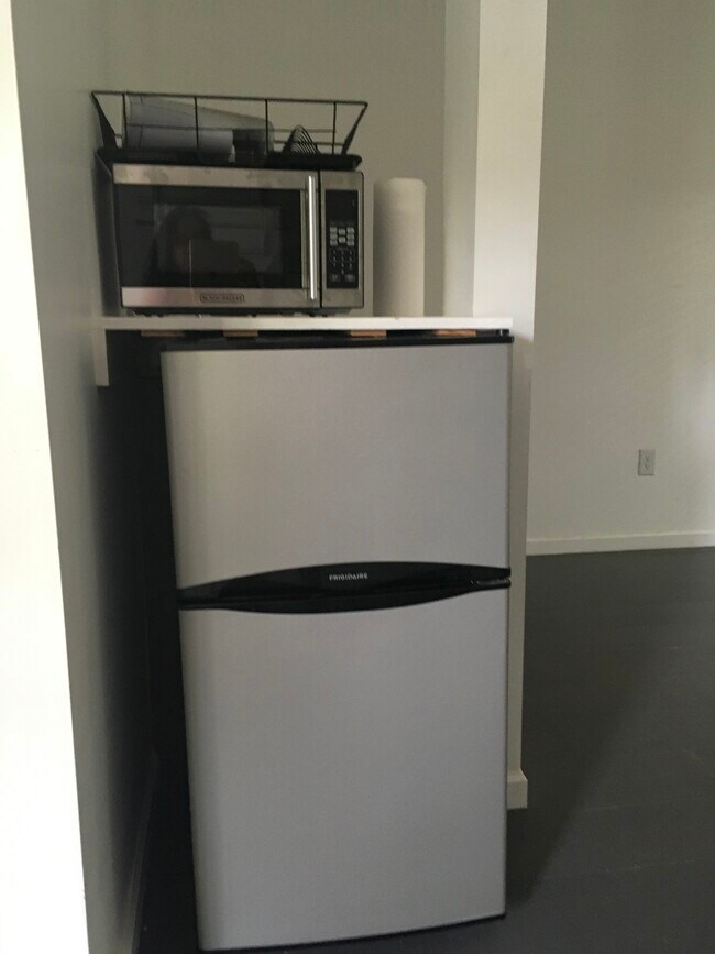 Refrigerator/ kitchen area - 2220 Rollingwood Dr