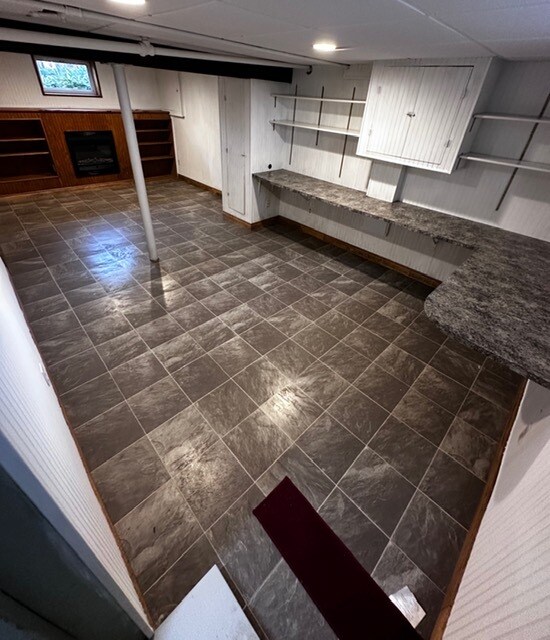 Finished Basement; countertop, shelves, electric heater, bookshelves - 11 Boxwood Ave