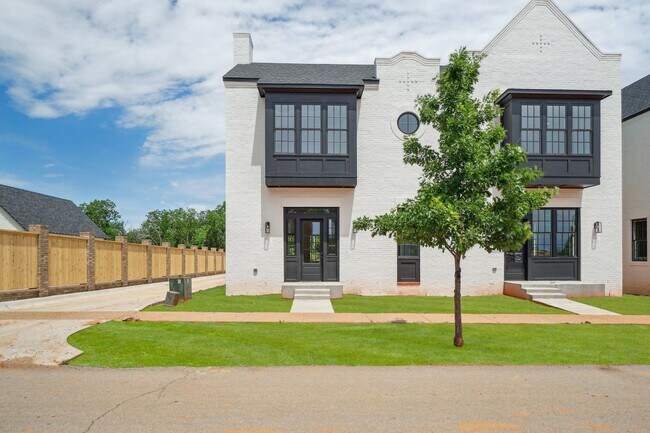 Building Photo - Classic Cape Cod Meets Modern Glam: Your D...