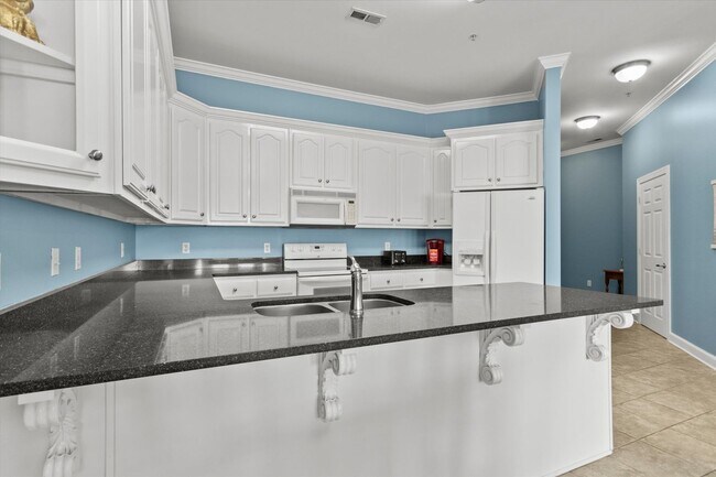 Building Photo - Riverfront Living with Spacious Layout and...