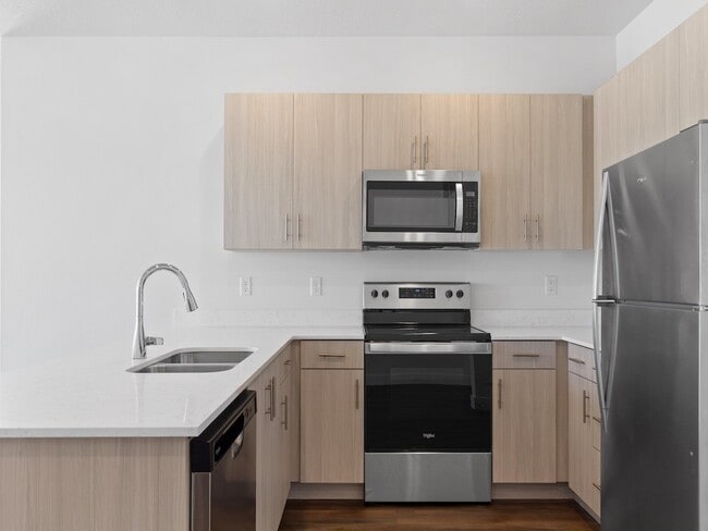 The Grove at Orchard Park Kitchen with Modern Appliances - The Grove at Orchard Park