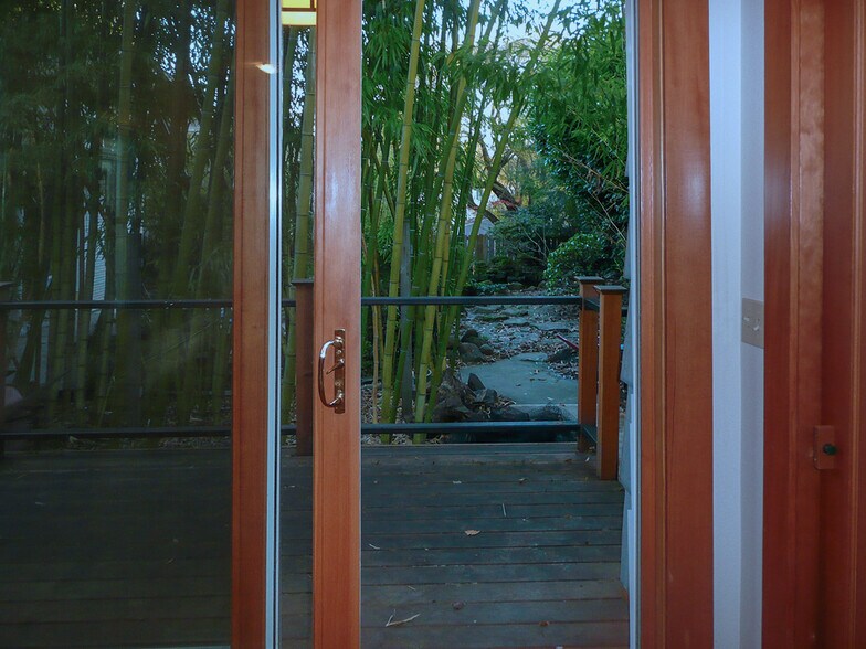 Looking out from bedroom area to deck and gard - 1114 SE 30th Ave