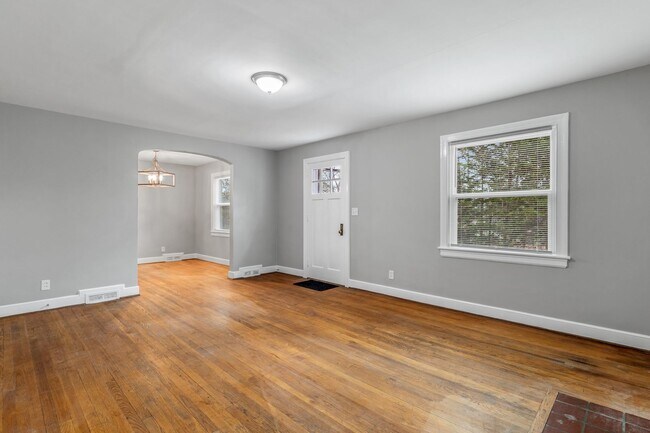 Building Photo - Brick home, Two Story, Hardwoods, DR, 2 Sun Rooms, FP, Carport!.