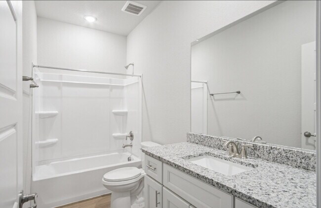 Building Photo - "Charming 3-Bedroom Duplex in San Antonio with Granite Elegance!"