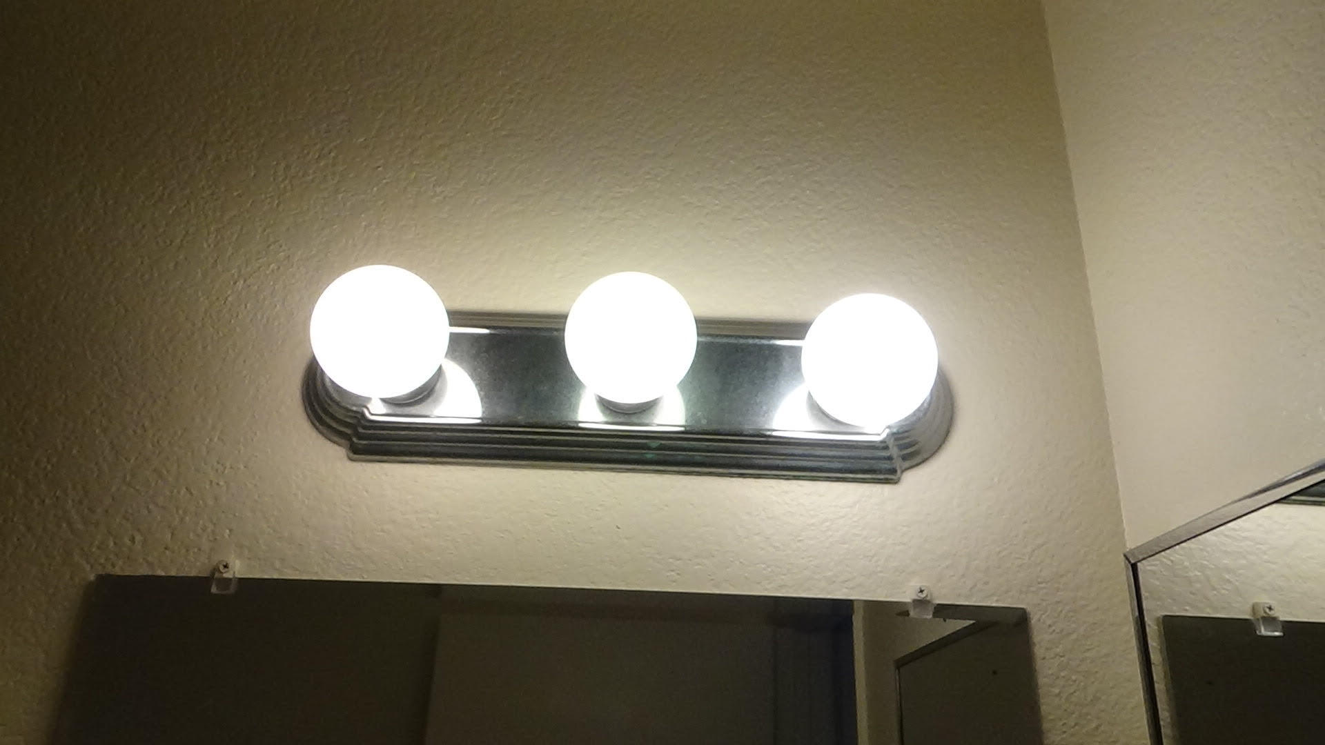 Bathroom lighting - 721 Summerwood Ln