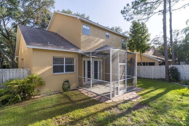 Building Photo - Beautiful 4/2 home Located on a tree lined street in the gate of country club community of the Hu...