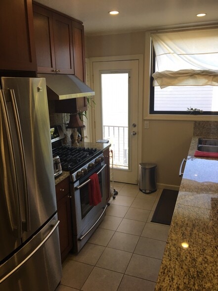 Gas stove and oven, access to backyard - 651 14th Street