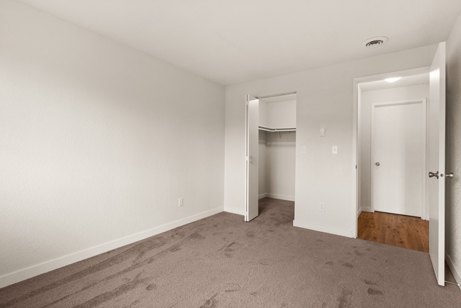 Explore this cozy and spacious bedroom, ideal for personal relaxation. - Monte Vista Apartments