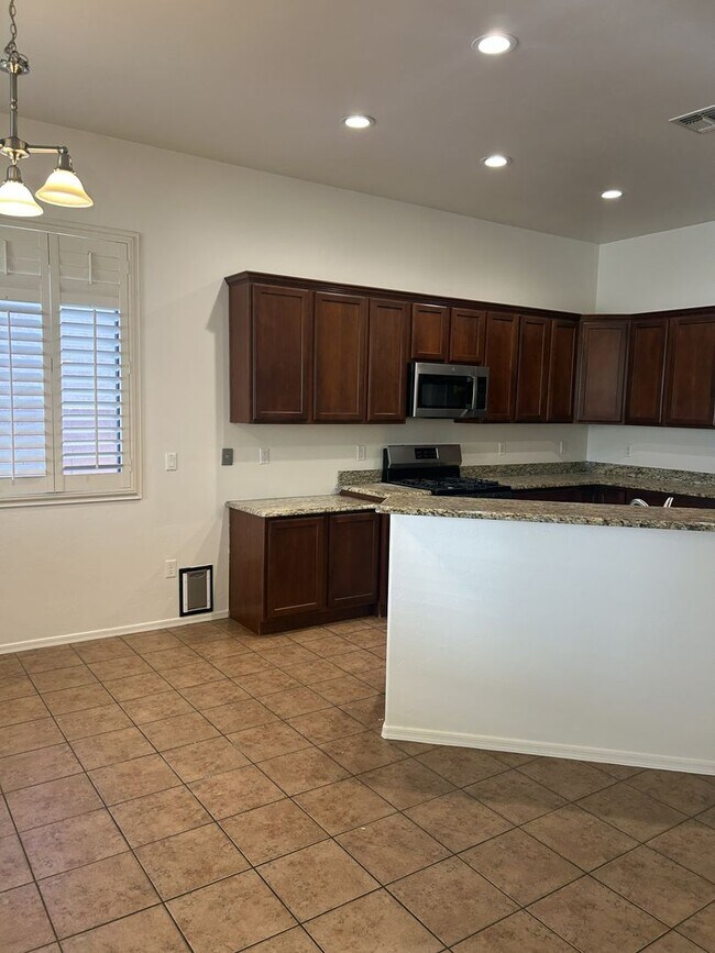 Building Photo - Unfurnished four bedroom large home!  Three car garage