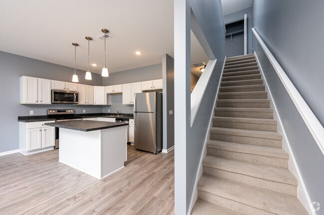 3BR, 2.5BA - 1,500SF - Kitchen/Stairs - Homestead Townhomes