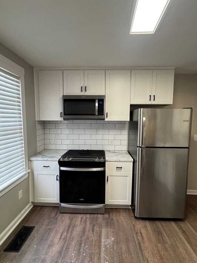 Building Photo - McQueen Street 4-plex - SMITK-LILY