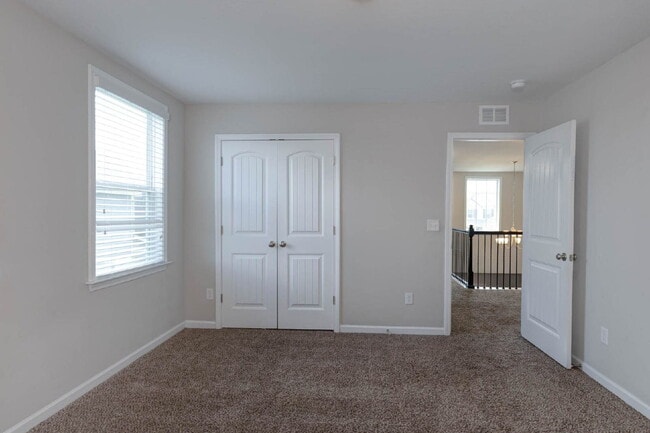 Building Photo - 4BR/3.5BA · 2,809 SF · Owner's Suite on Main · Fenced Yard · Midland, GA — $2,800/mo