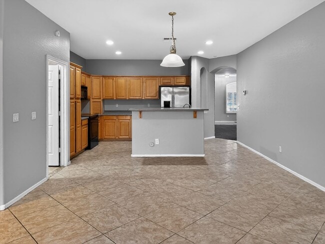 Building Photo - Single-level 4 bed, 2 bath home with tandem 3-car garage and RV gate.