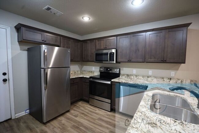 Building Photo - Move in special $800!! Luxury 2 bed, 1 bath duplex - recent construction!! Washer, dryer and inte...