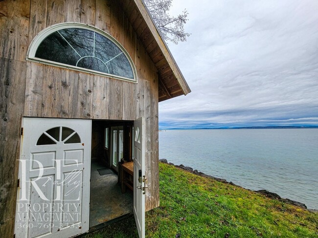 Building Photo - MOVE-IN SPECIAL: 50% OFF FIRST MONTHS RENT - Waterfront Rustic Retreat with Vaulted Ceilings, Pic...