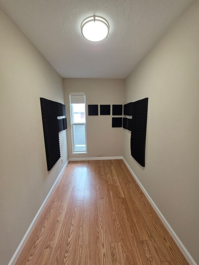 Building Photo - Spacious 2BR Condo with Central A/C, Bonus Room & Huge Storage – Walk to Burlingame Avenue