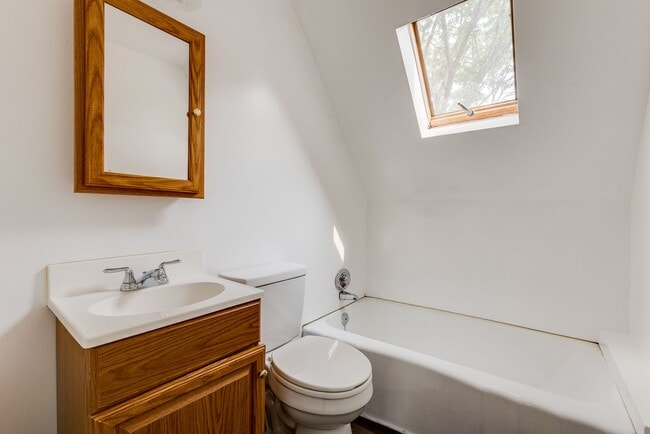 Building Photo - AVAILABLE June 2026 - Beautiful 4 Bedroom, 2 Bath Home w/ Front Porch Swing!