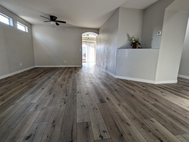 Spacious living room with LVP flooring - 11813 W Maui Ln