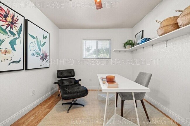 Building Photo - Welcome to this stunning 4-bedroom, 2-bath...