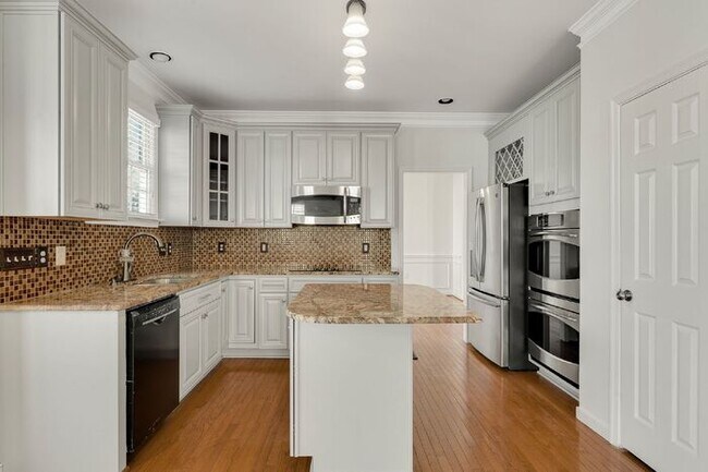 Building Photo - Spacious 5 Bedroom Home with 3rd Floor Suite, Fenced Yard & Community Amenities – $3,500/mo