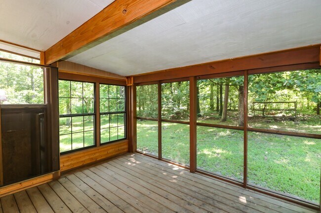 Building Photo - Two Bedroom, 2 Bath, 1-Car Garage, 1179 sq ft feet home with wood burning fireplace. and screened...