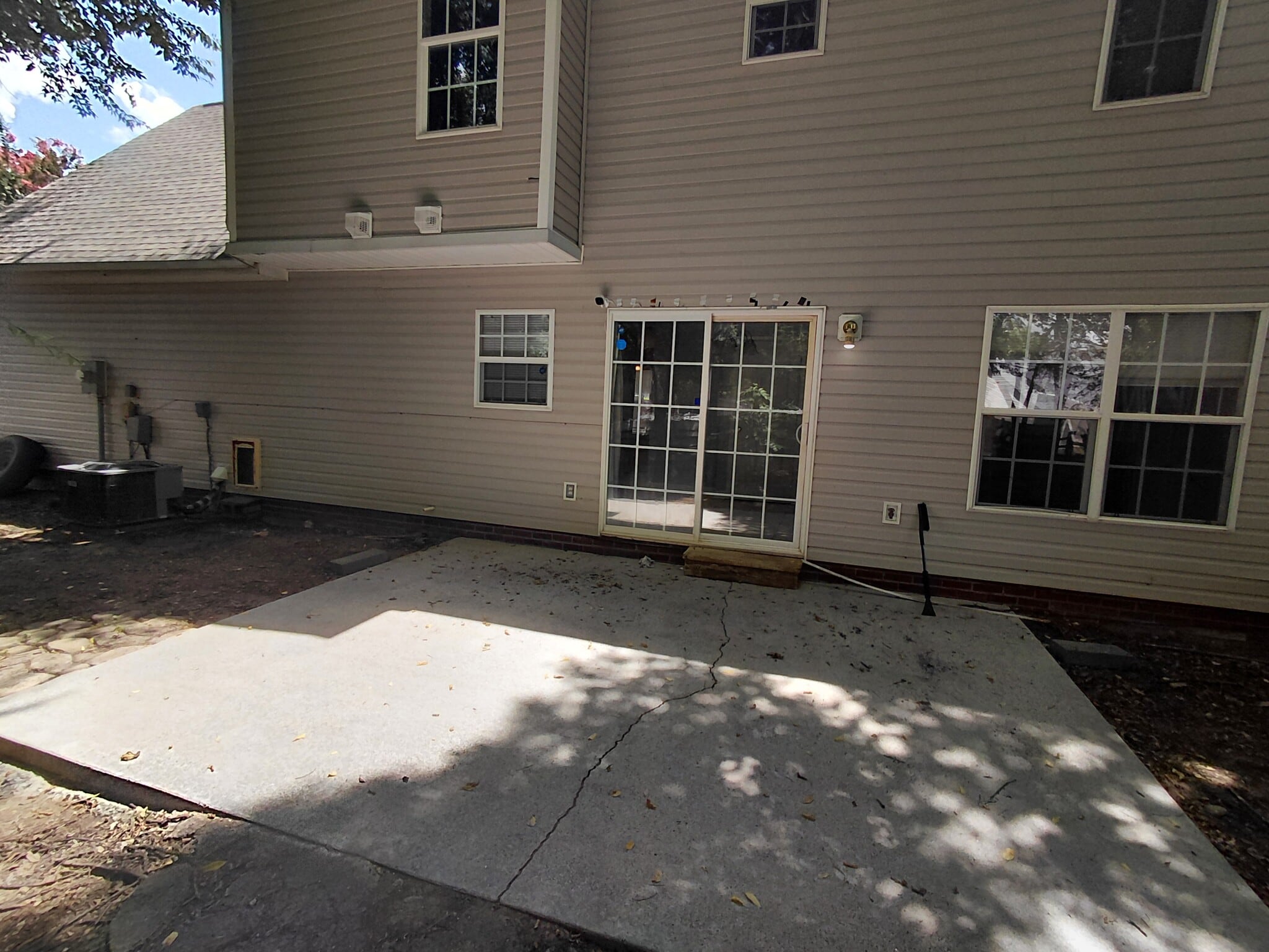 Large patio overlooks wooded fenced backyard - 5043 Wheat Dr SW