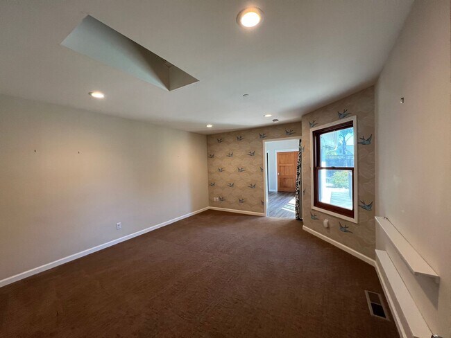 Building Photo - Spacious 4-Bedroom Retreat Just Steps from...