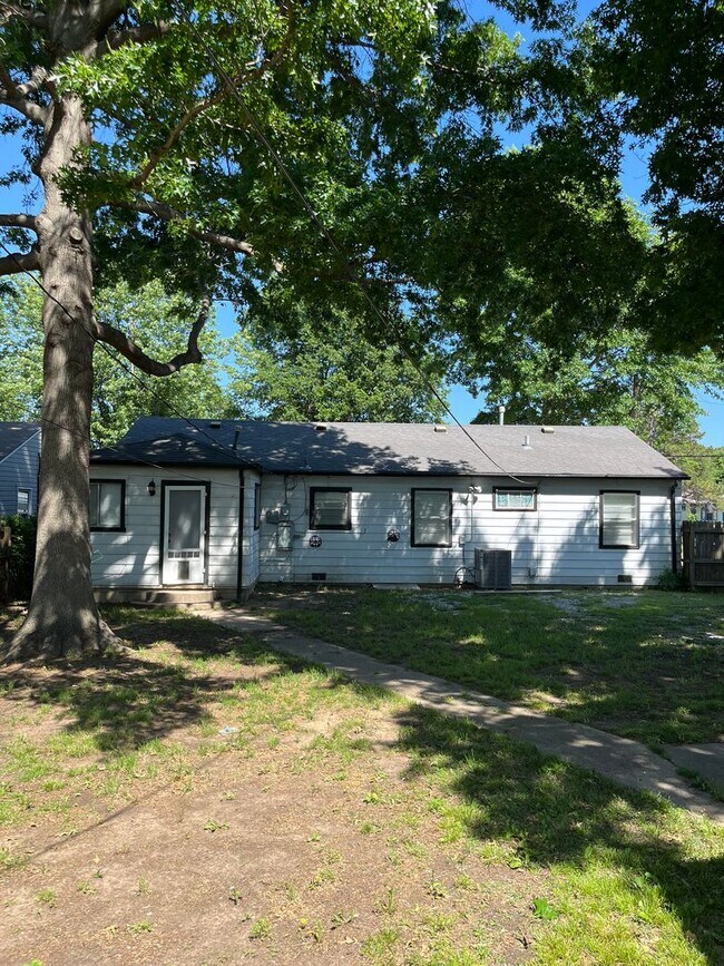 Building Photo - Step into this beautifully updated 1950's gem, where charm meets modern convenience