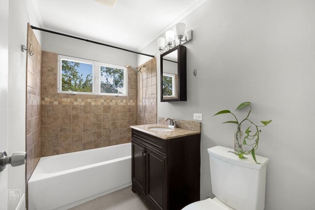 Building Photo - Elmhurst Three Bedroom Home with Fenced Yard and Detached Garage