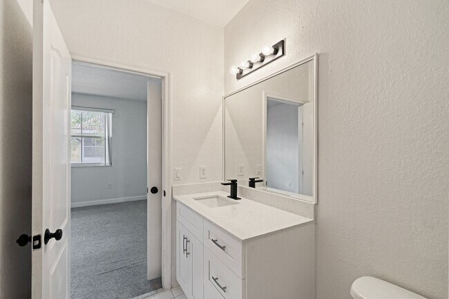 Building Photo - 2-bath condo on the 2nd floor with a newly...