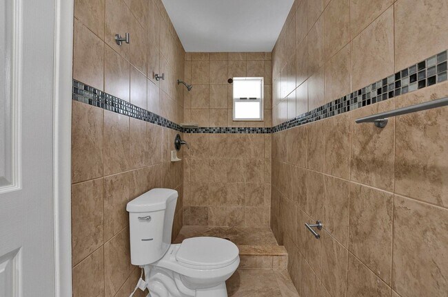 Building Photo - Sunrise Gem: Updated 2-Bed, 2-Bath with Garage Parking