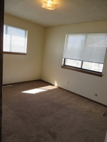 Building Photo - 3 bedroom Ranch Style Duplex backing to open space.