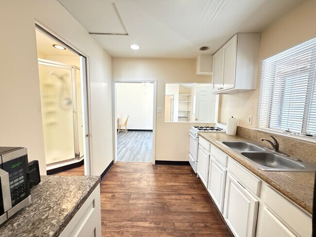 Building Photo - READY TO MOVE IN- MUST SEE - TWO CAR OFF STREET PARKING SPOTS AND UTILITIES PAID