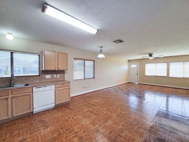 Building Photo - 3 bedroom one story home on large corner lot. Home has hard flooring throughout living areas and ...