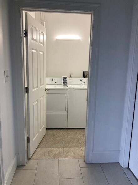 Shared laundry next to entry door - 231 Lake Ave