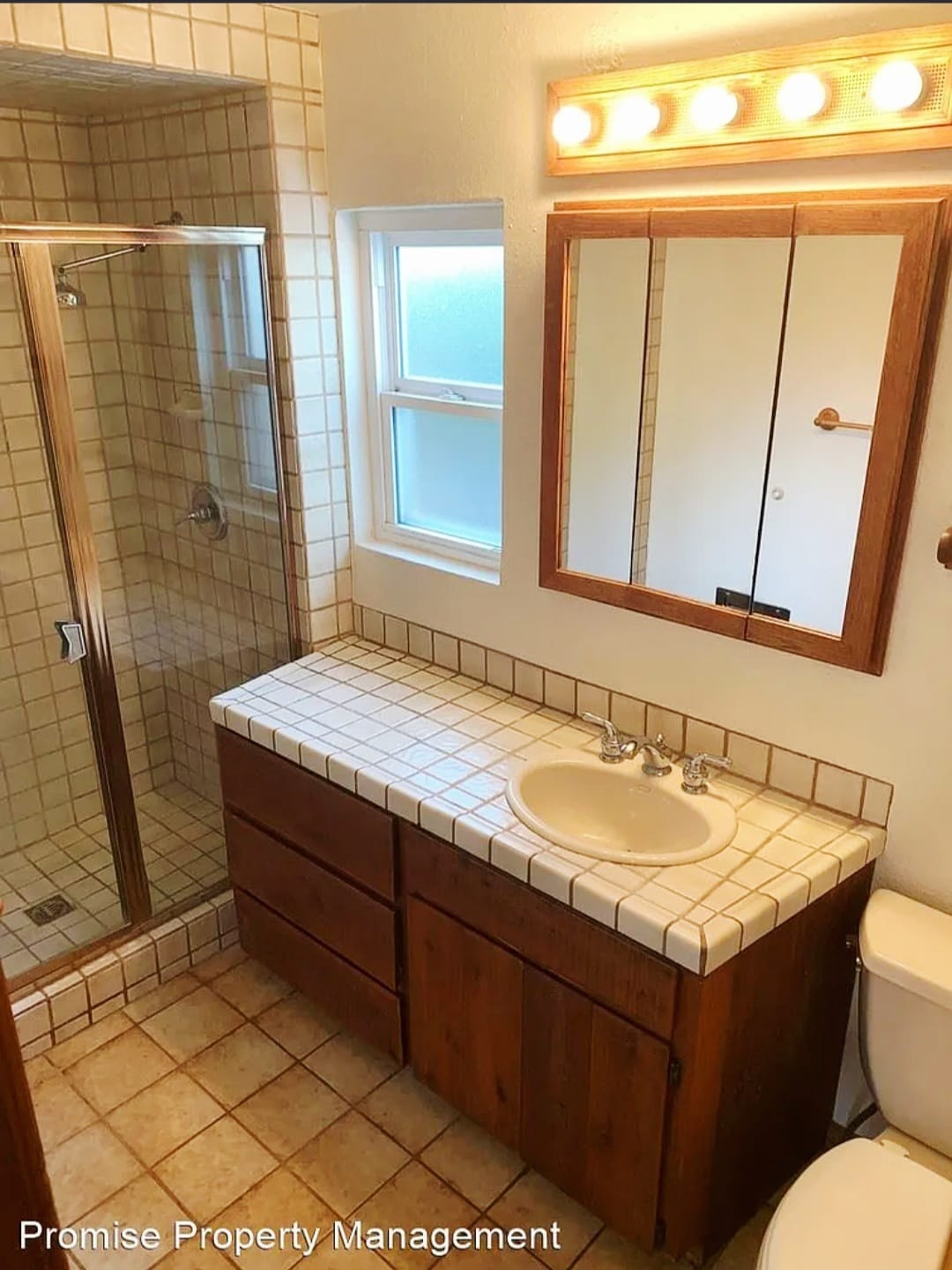 Spanish tiled bathroom & floors. - 934 S Myers St