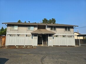 Building Photo - Upper Floor 2 Bedroom with Carport